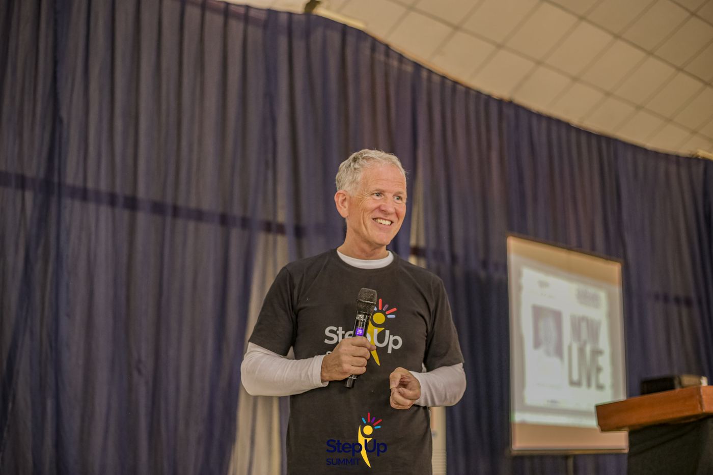 Speaking on stage at Step-Up Summit