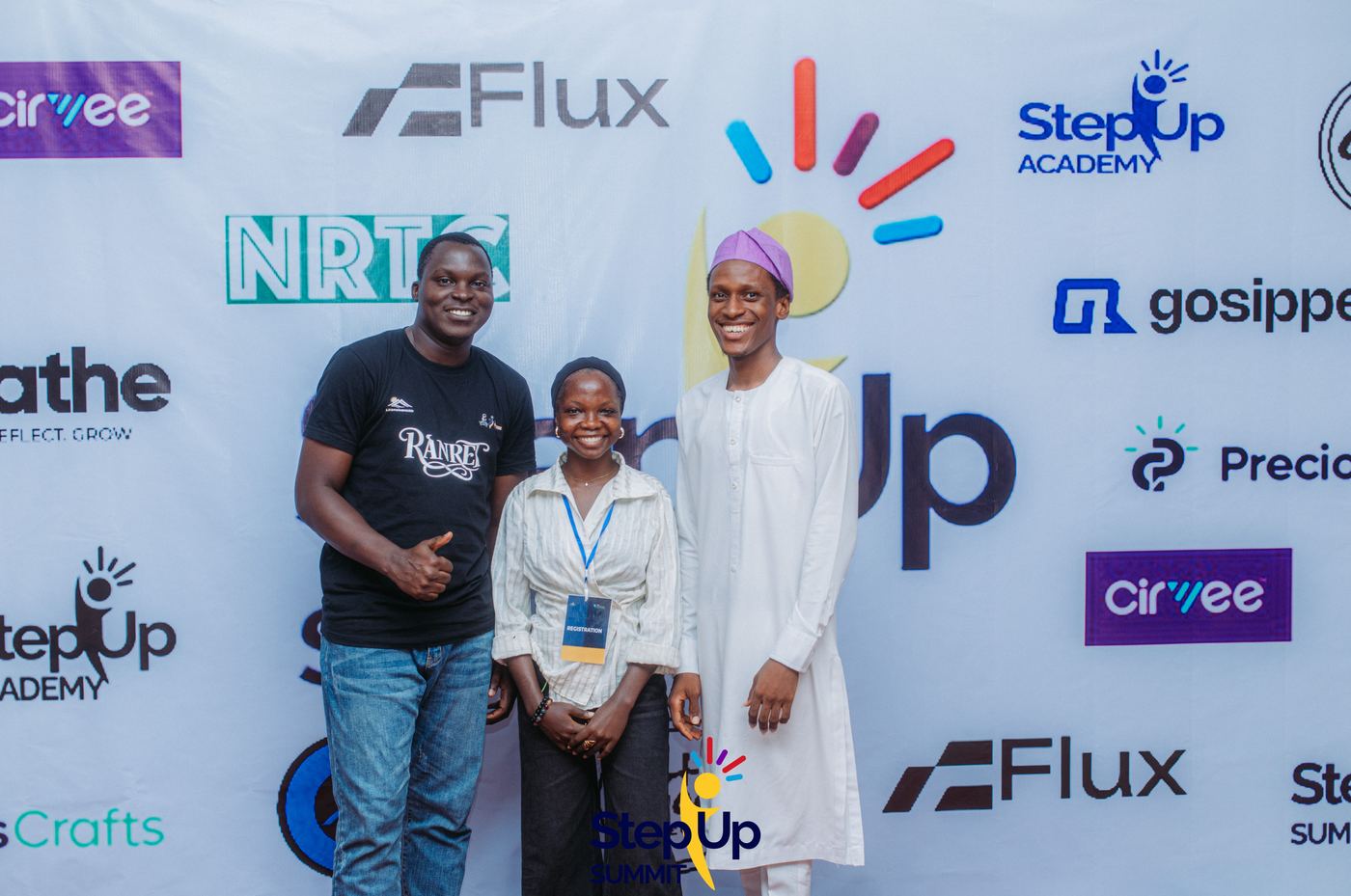 With the sponsors wall at Step-Up Summit